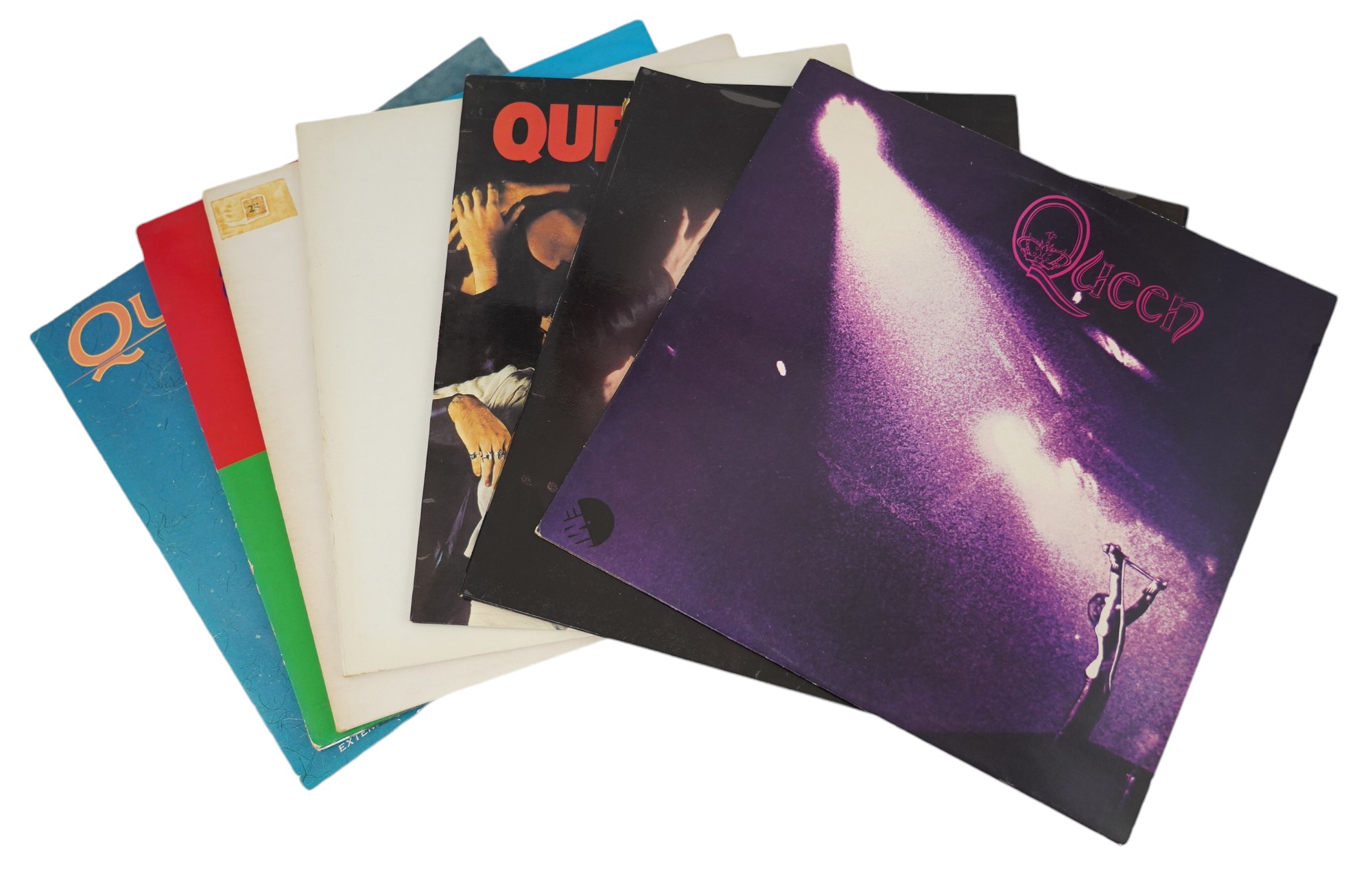 Seven Queen LP record albums and a 12” single; Queen, Queen II, Sheer Heart Attack, A Night at the Opera and another, Hot Space, The Game, and a 12” A Kind of Magic. Condition - fair to good